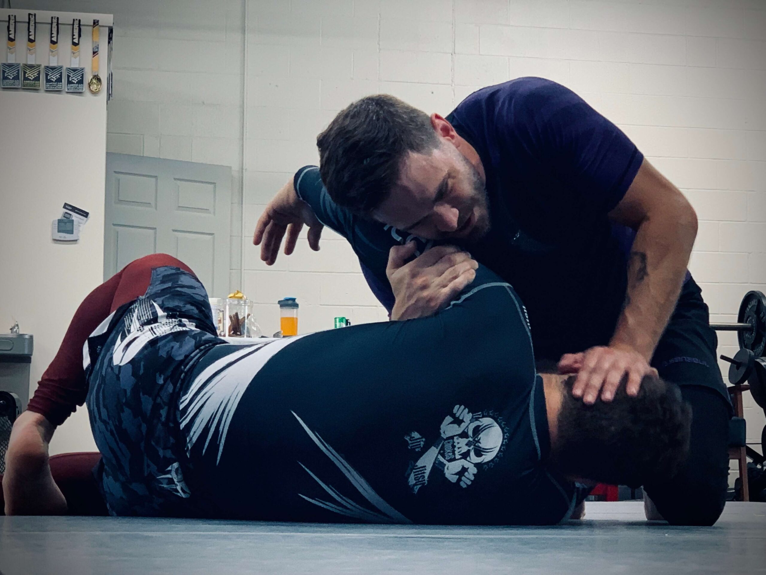 Two men sparring at a martial arts gym