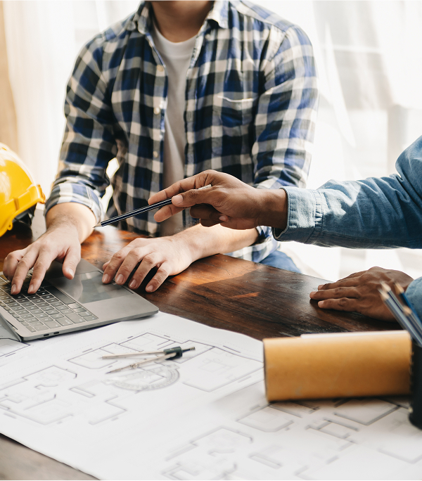 Project managers discussing web design for contractors