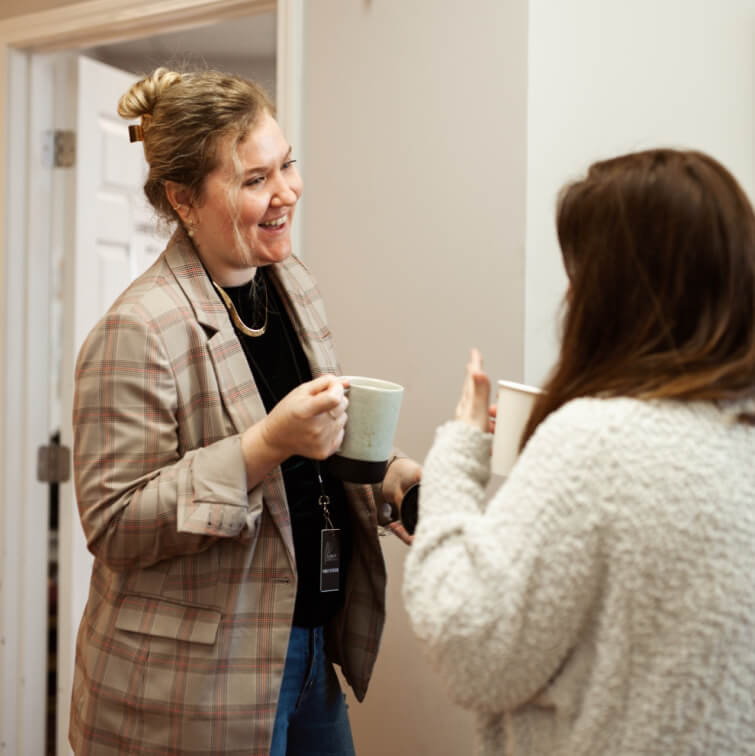 A woman greeting a fellow church goer